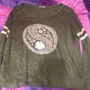 green long sleeved shirt with peace sign